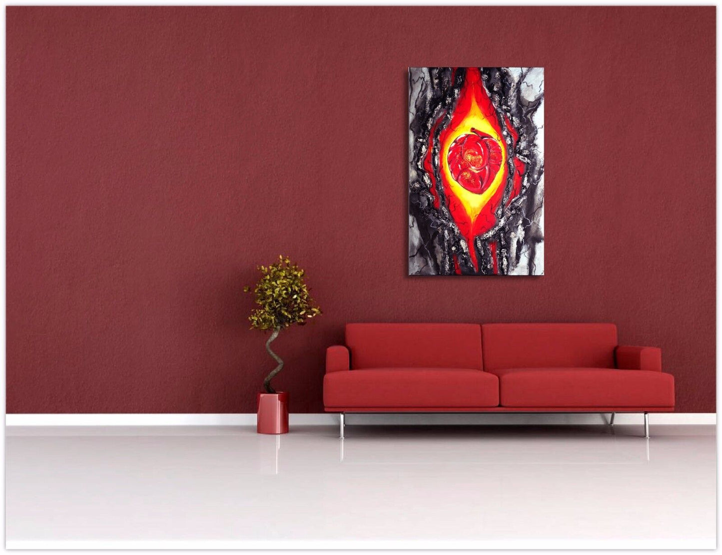 a fire place sitting in front of a red wall 