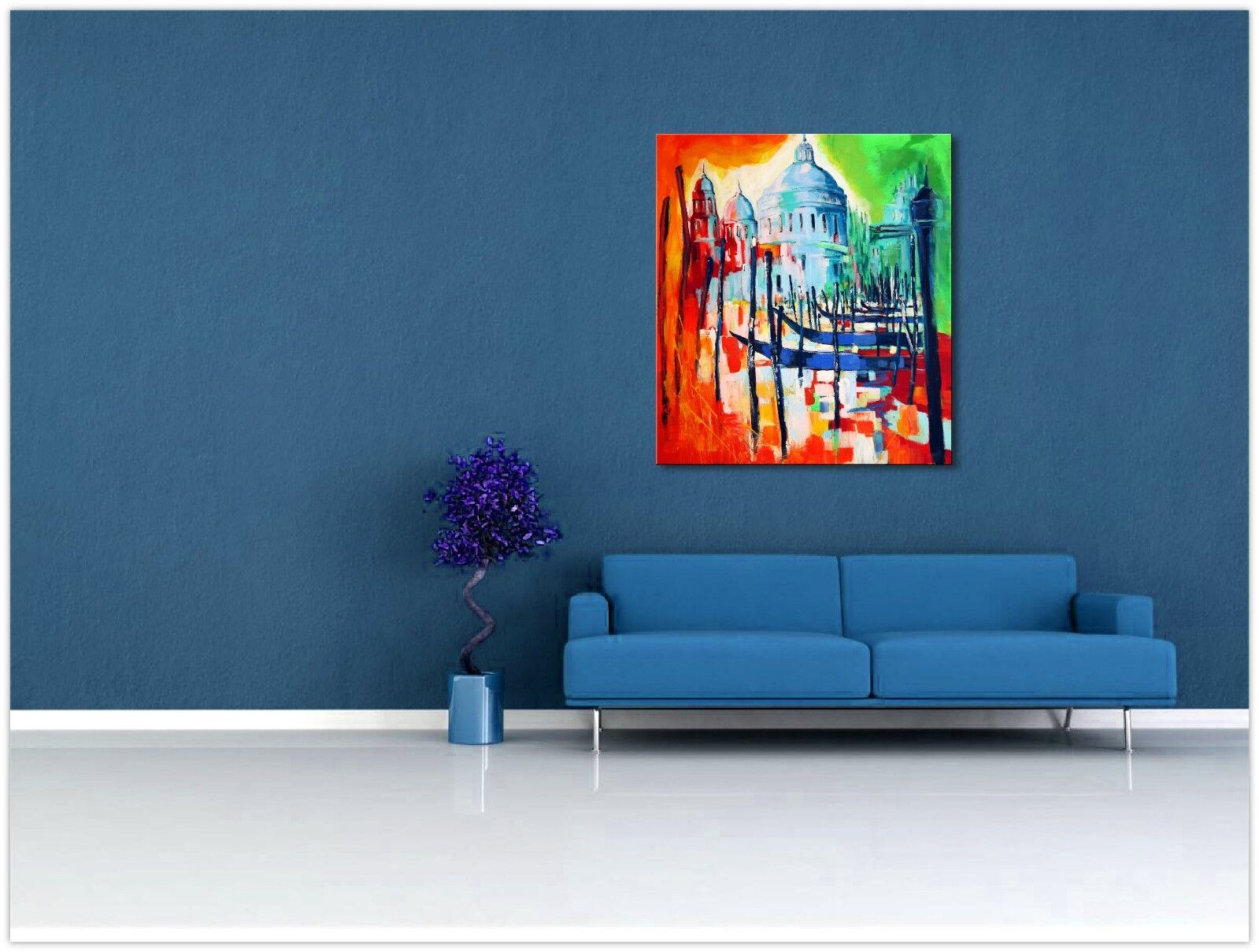 a living room with blue walls and a painting 